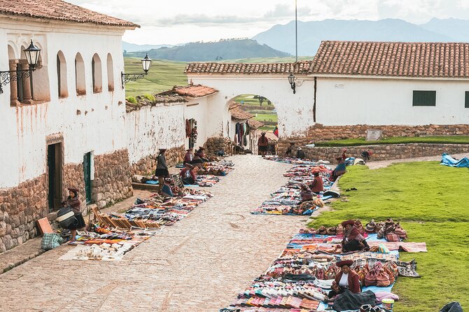 2 Day Sacred Valley and Machu Picchu Guided Tour from Cusco - Pisac: market energy plus archaeological remains