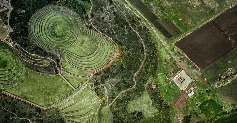 From Ollantaytambo: Moray, Maras, and Chinchero Guided Tour - Maras salt pools at Salineras: working pans you can still see