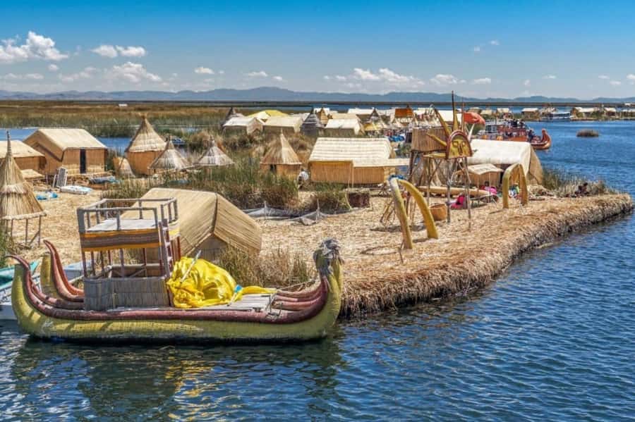 From Puno: Uros and Taquile Islands Full-Day Tour - Uros floating islands: reed rush, sponge-like movement, and local life
