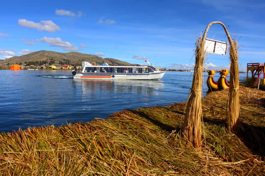 From Puno: Uros floating islands half Day tour - The optional handmade boat ride: plan for extras