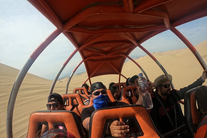 Full day Tour Paracas Ica & Huacachina from Lima. - Huacachina Oasis: dune buggy tubulares and sandboarding time