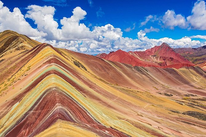 Private Rainbow Mountain Tour From Cusco – Vinicunca Rainbow Mountain - Dirt road to glacier views, with Ausangate in the background