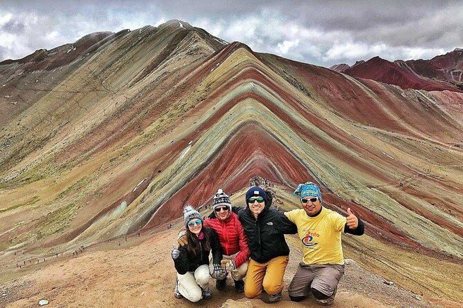 Rainbow Mountain Perú Full Day Group Shared Service - Summit time at Vinicunca: mineral stripes, a guide briefing, and real photo breaks